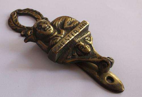 A CHARMING ANTIQUE INTERNAL DOOR KNOCKER DEPICTING THE CHESTER IMP ....PIXIE TYPE CREATURE...CUTE !!