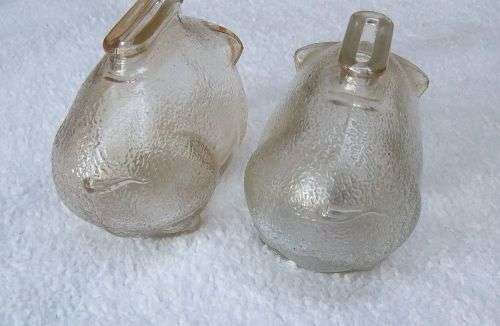 TAKE TWO !! A CUTE PAIR OF VINTAGE GLASS PIG FORM MONEY BANKS IN GOOD CONDITION