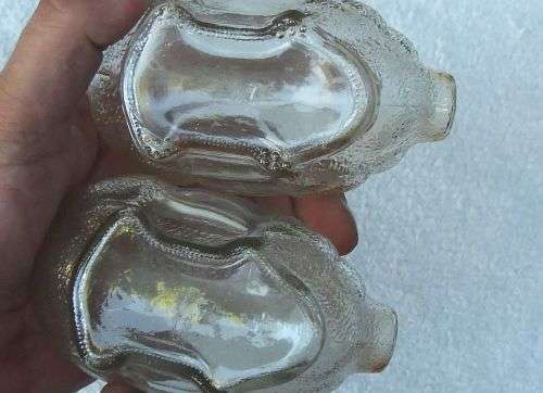 TAKE TWO !! A CUTE PAIR OF VINTAGE GLASS PIG FORM MONEY BANKS IN GOOD CONDITION