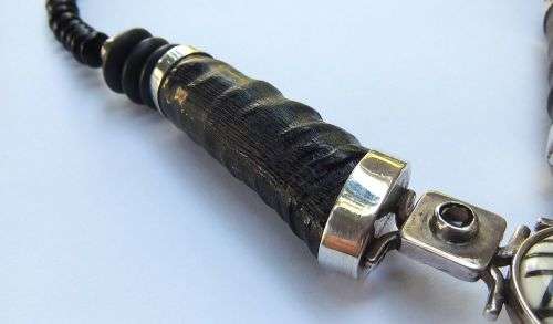 A ONE OF A KIND BUCK HORN , BONE , TIGERS EYE , BLACK STONE AND STERLING SILVER NECKLACE !!