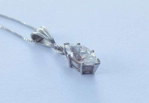 AN ELEGANT STERLING SILVER PENDANT SET WITH A MARQUISE CUT STONE PLUS A STERLING SILVER NECKLACE !!