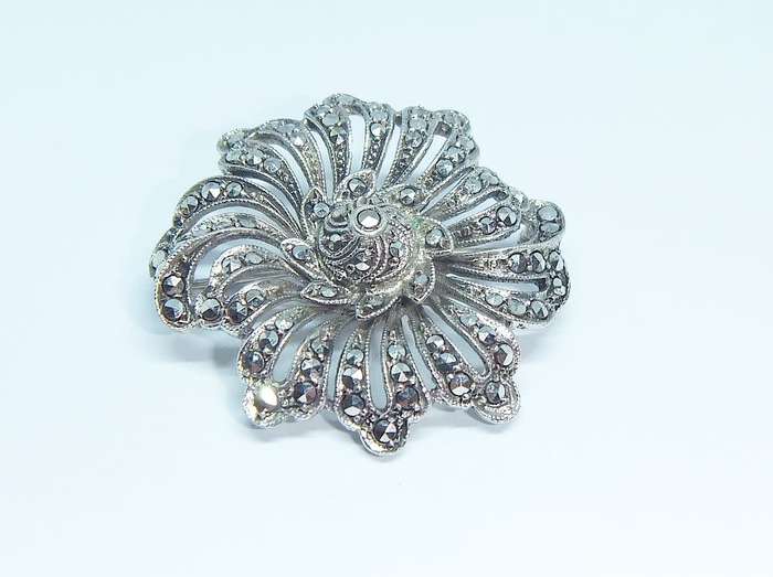 A gorgeous vintage solid silver brooch filled with marcasite