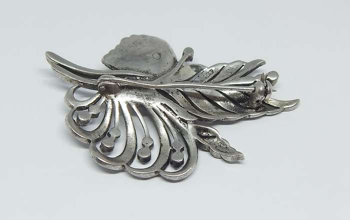 A magnificent vintage solid sterling silver leaf form brooch filled with marcasite