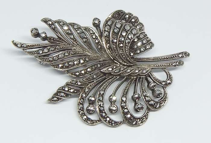 A magnificent vintage solid sterling silver leaf form brooch filled with marcasite