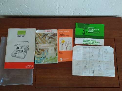 Sewing table, sewing machine and overlocker