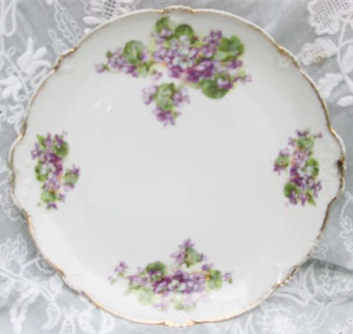 ANTIQUE GERMAN PORCELAIN CAKE PLATE WITH VIOLET DESIGN, EDGES BRUSHED WITH GOLD.