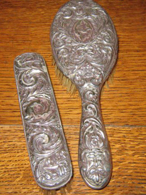 TWO BRUSHES   WITH   STERLING SILVER HANDLES