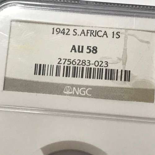 1942 SA Union shilling NGC graded AU 58 - Cracked die through neck variety