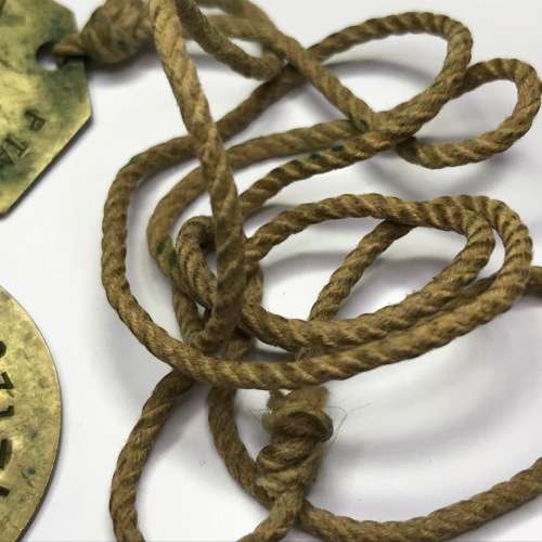 Set of 2 tags marked P Taylor 05541071 - 1