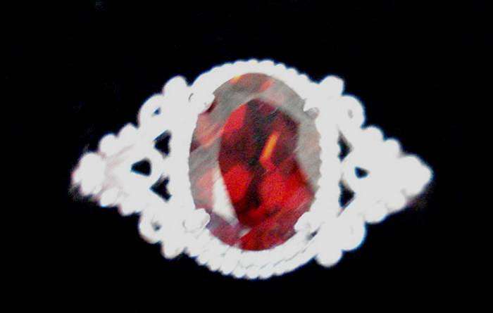 9k White gold plated Rhodolite  and white topaz ring.   1.200cts