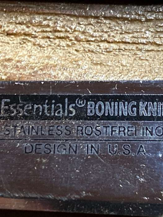 Boning knife in leather sheath