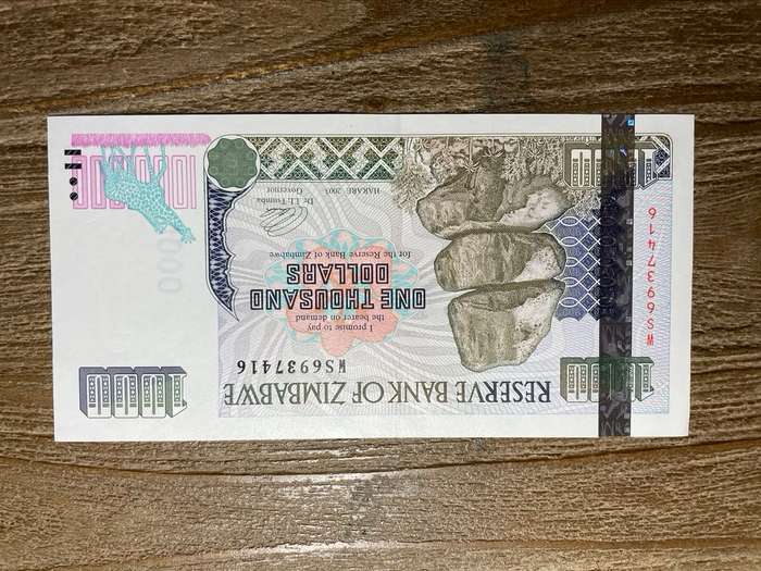 Zimbabwe   *  $1000  *  issued 2003  *  au left slight fold