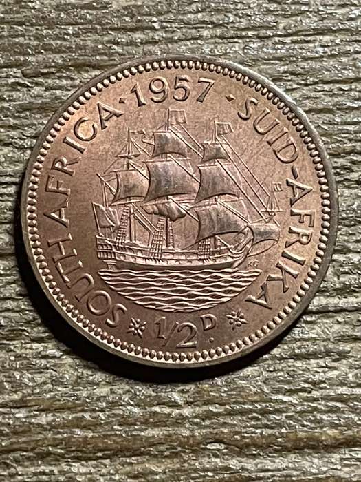 1957 *** 1/2 Penny *** Unc dealer stock