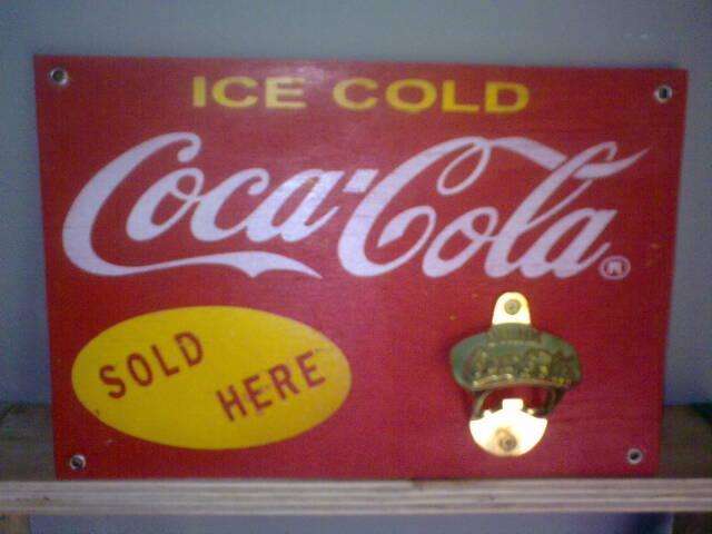 Coca Cola Bottle Opener and Wooden Sign.