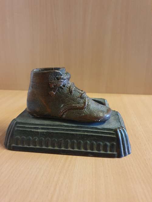 Copper Shoe Display on a Metal Stand