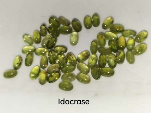 50 PIECES UNTREATED TOP GREEN NATURAL IDOCRASE-VESUVIANITE OVAL GEMSTONES. BID PER STONE
