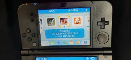 New Nintendo 3D XL ( has a small craxk on the right upper screen corner)