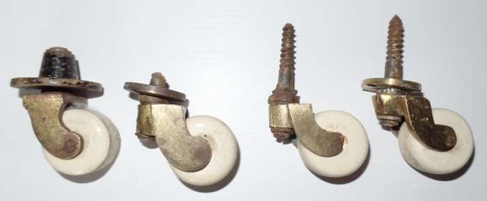 ANTIQUE VICTORIAN BRASS AND CERAMIC CASTORS X 4