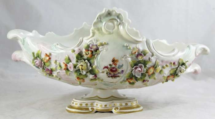 Very old center piece on stand - embossed flowers