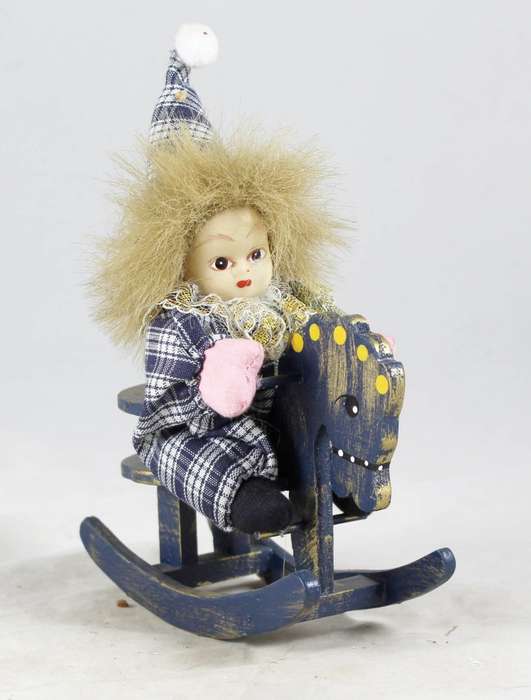 Baby clown on rocking horse