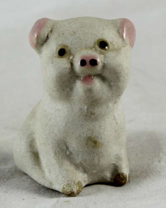 White smiling pig with pink ears