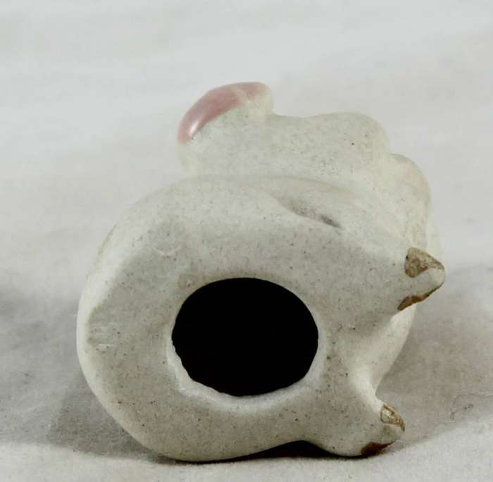 White smiling pig with pink ears