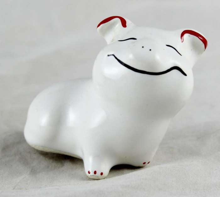 Wide smiling pig with red ears