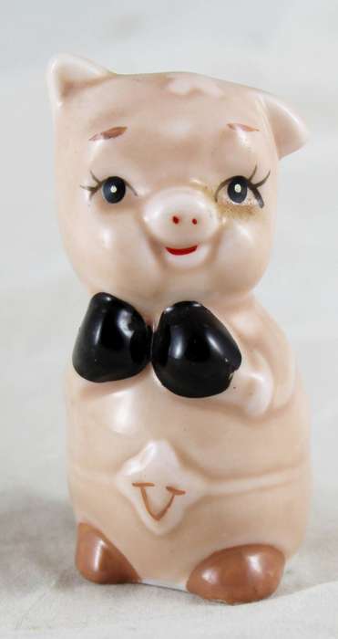 Pink pig with black gloves