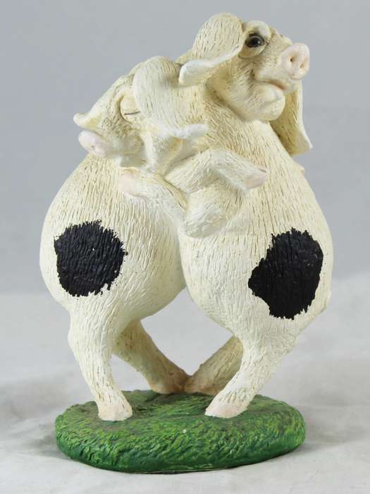Pair of pigs hugging