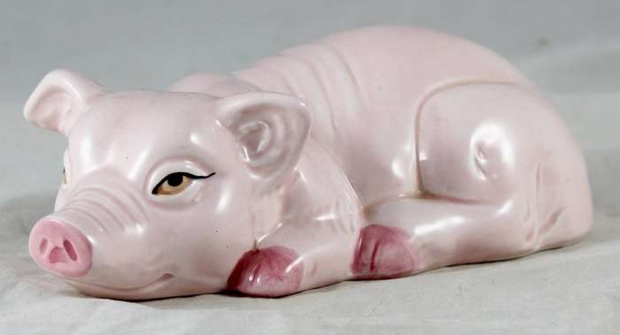 Pink pig laying down