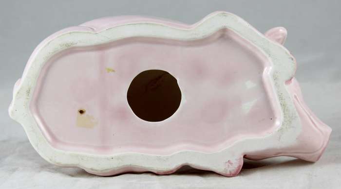 Pink pig laying down
