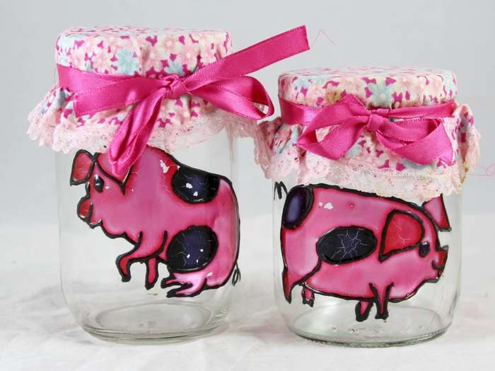 Pair of glass pig painted jars