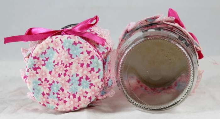 Pair of glass pig painted jars