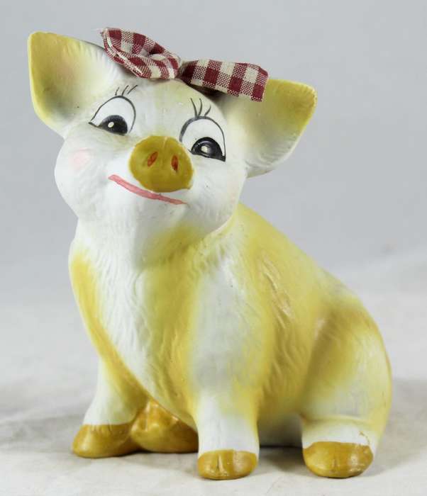 Yellow pig with red & white bow