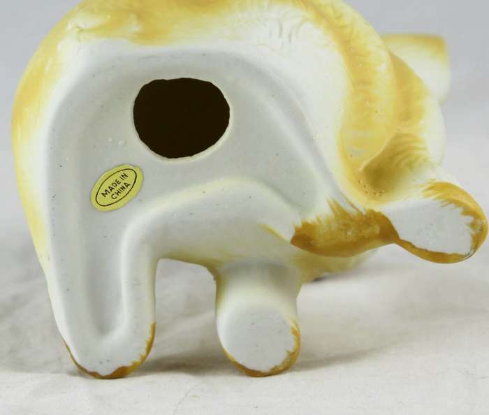 Yellow pig with red & white bow