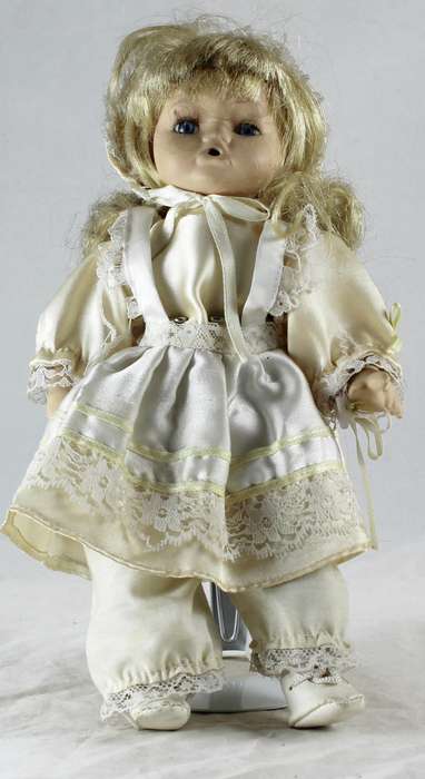 Baby doll on stand