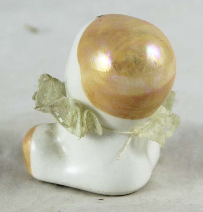 Small porcelain baby with lace collar - light orange head