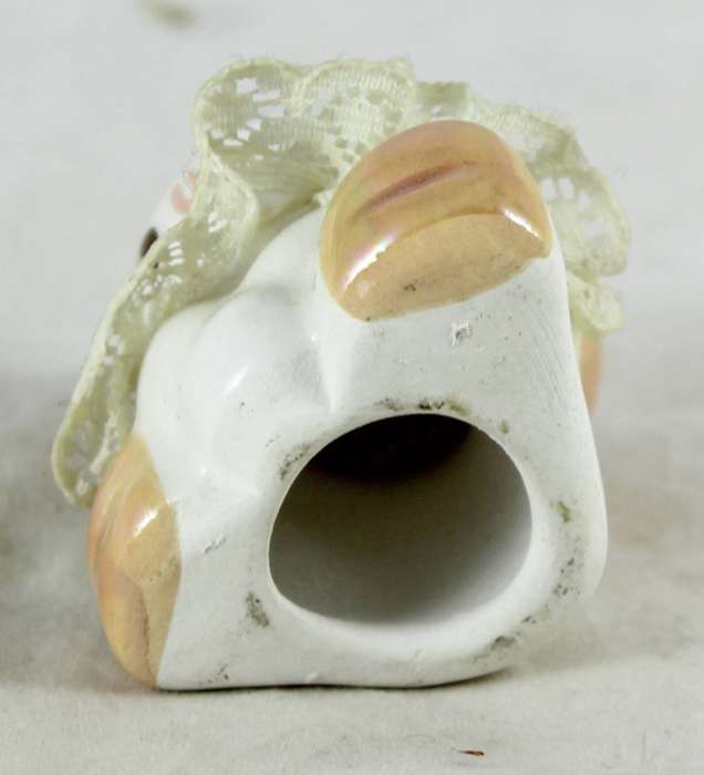 Small porcelain baby with lace collar - light orange head