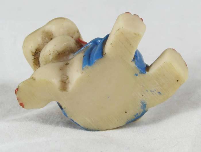 Miniature seated hippo with suspenders