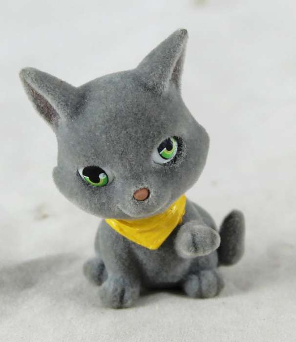 Miniature suede kitten with yellow cravat