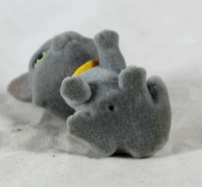 Miniature suede kitten with yellow cravat