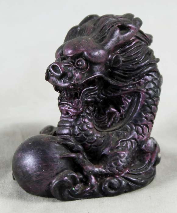 Small purple dragon with crystal ball