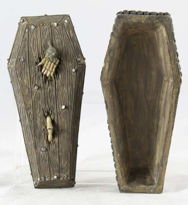 Molded coffin with protruding bones