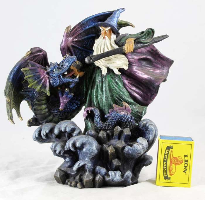 Large wizard fighting dragon