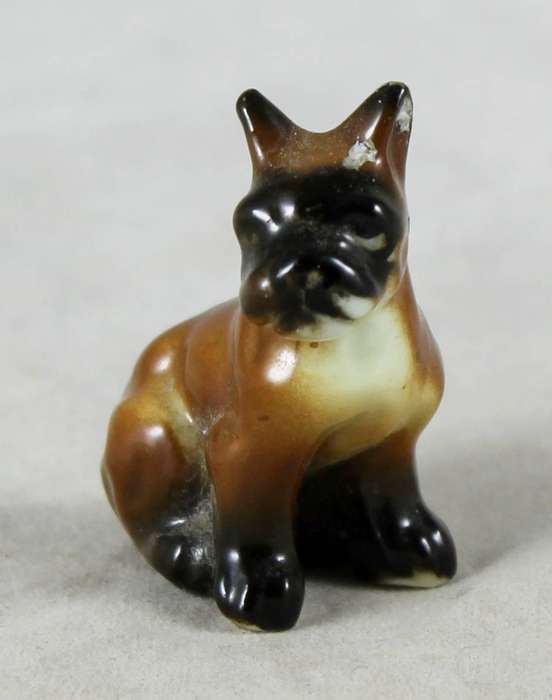 Miniature porcelain dog - seated boxer