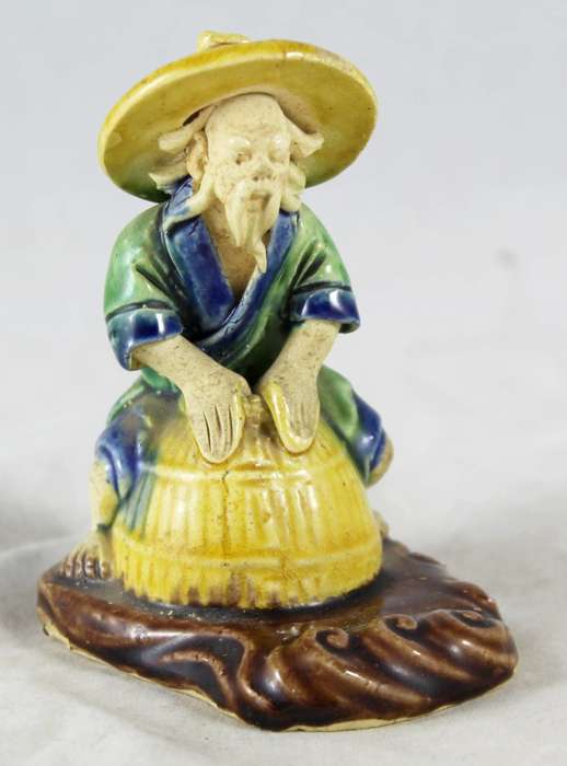 Mud man on a pot