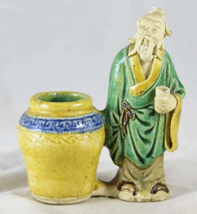 Mud man with big pot