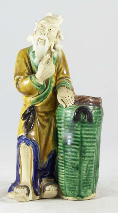 Mud man with big green pot