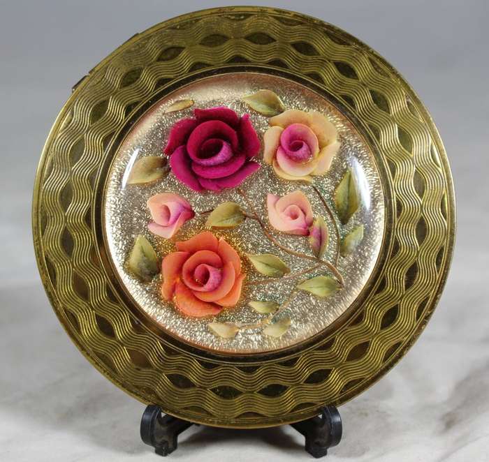 Domed rose embossed powder compact