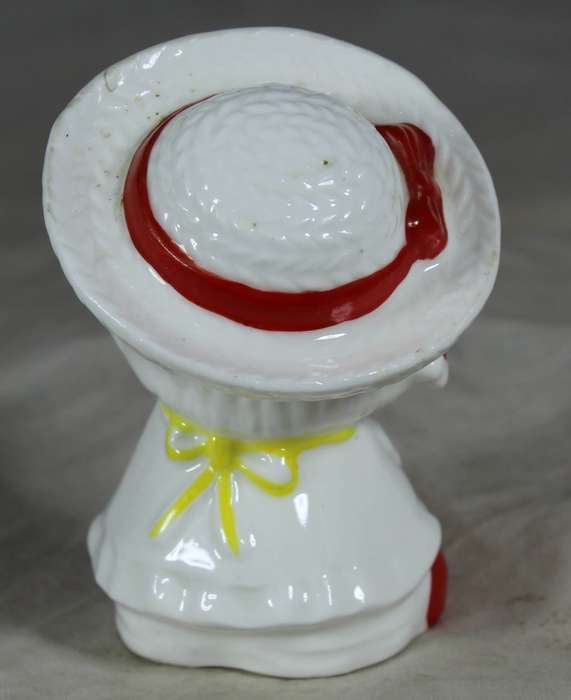 Porcelain happy girl with strawberry dress
